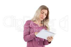 Young woman focused on her tablet pc
