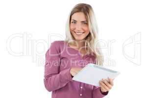 Smiling blonde woman using tablet pc