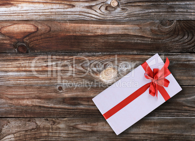 Gift box over wooden background