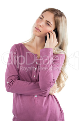 Thoughtful woman on the phone