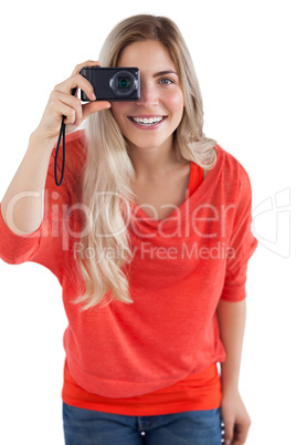 Blonde woman holding digital camera