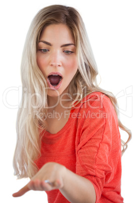 Surprised woman looking at her engagement ring