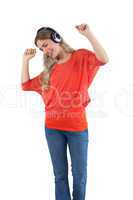 Smiling woman listening to music with headphones