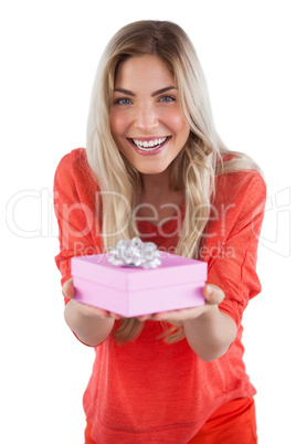 Young woman offering gift