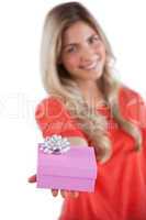 Young woman giving a gift