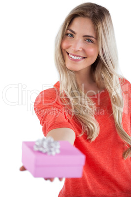 Blonde woman offering a present