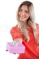 Blonde woman offering a present
