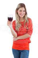 Smiling woman looking at the camera with red wine glass
