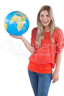 Cheerful woman holding globe