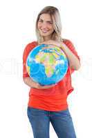 Smiling woman presenting a globe
