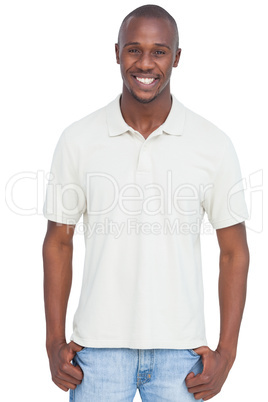 Smiling man with thumbs in pocket