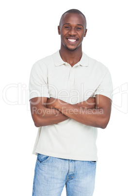 Smiling man posing with arms crossed