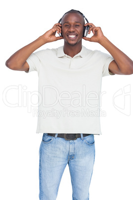 Smiling man using headphones