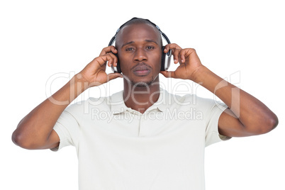 Concentrated man listening to music