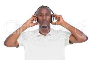 Concentrated man listening to music