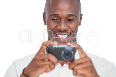 Smiling man taking picture