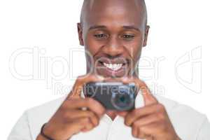 Smiling man taking picture