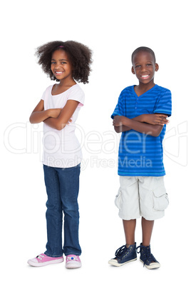 Brother and sister with arms crossed