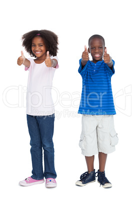 Brother and sister with thumbs up