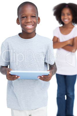 Smiling little boy using tablet pc