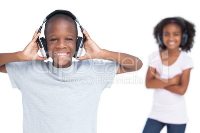 Brother and sister listening to music