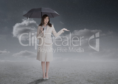 Businesswoman holding an umbrella