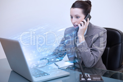 Businesswoman using laptop with blue lights exploding from her s