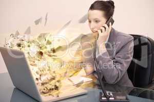 Laptop screen of a businesswoman exploding
