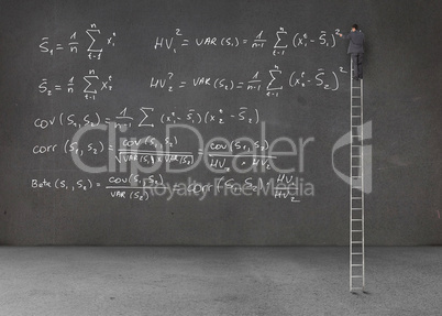 Businessman standing on a ladder