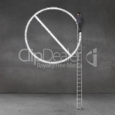Businessman standing on a giant ladder and drawing forbidden sig
