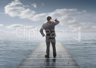 Businessman standing on a bridge