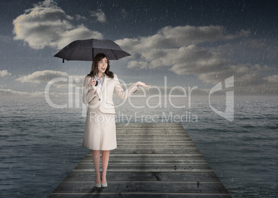 Elegant businesswoman holding an umbrella