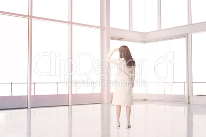 Businesswoman standing in an empty room