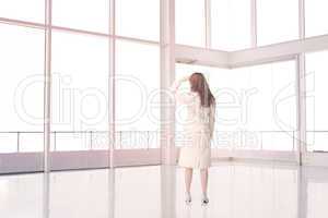 Businesswoman standing in an empty room