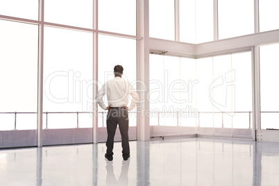 Businessman standing in an empty room