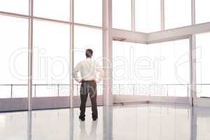 Businessman standing in an empty room