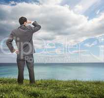 Stylish businessman looking at the sea