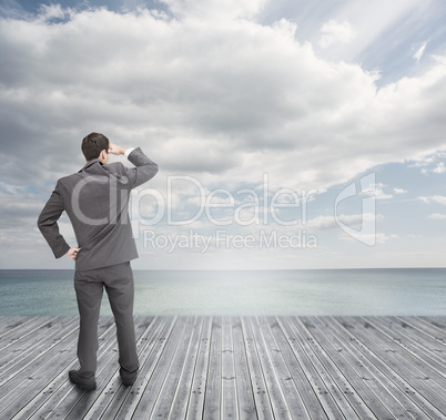 Well dressed businessman standing on wooden boards