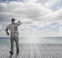 Well dressed businessman standing on wooden boards