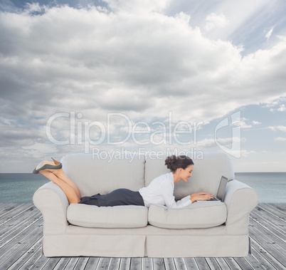 Businesswoman lying on couch