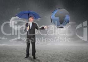 Businessman with blue umbrella