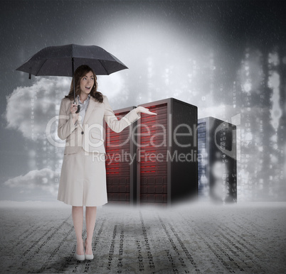Businesswoman in front of servers holding umbrella