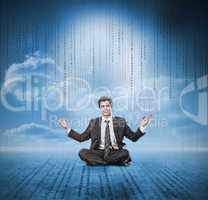 Businessman meditating and smiling