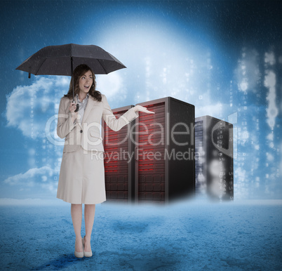 Businesswoman with umbrella in front of red servers