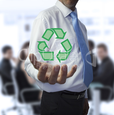 Businessman holding the recycling symbol