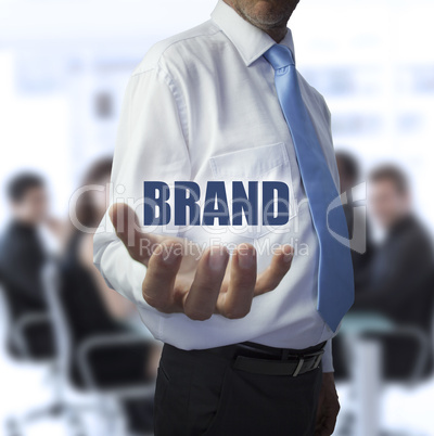 Smart businessman holding the word brand Smart businessman holding the word brand