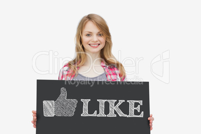 Smiling girl holding panel with thumb up representing social net