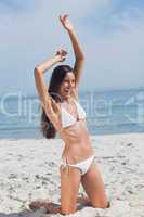 Happy woman on beach posing