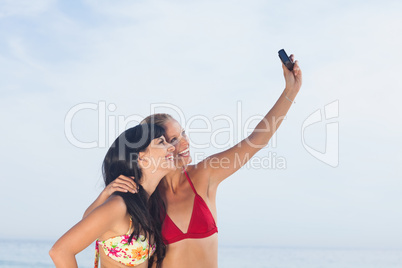 Women taking picture and smiling