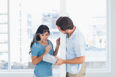 Man offering gift to his girlfriend
